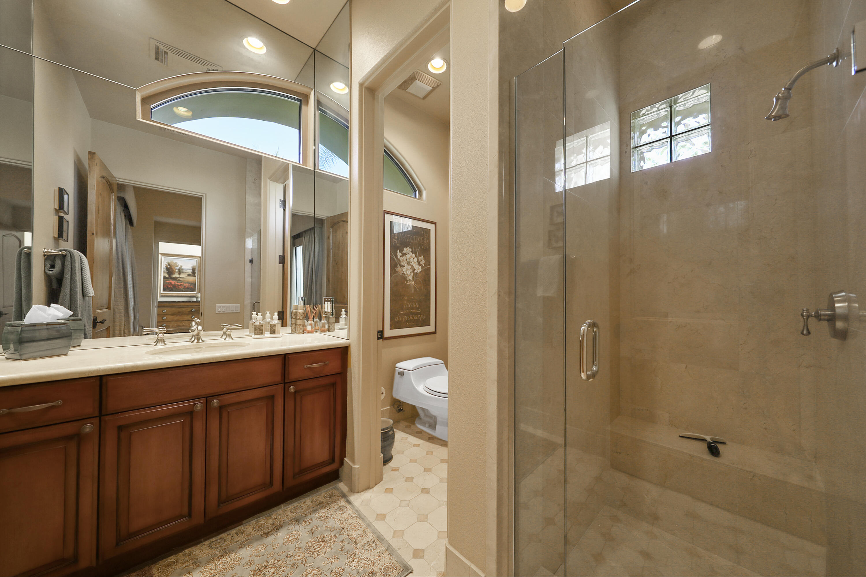 50360 Woodmere La Quinta, CA 92253 - Photo 30 of 56 a bathroom with a double vanity sink and a mirror