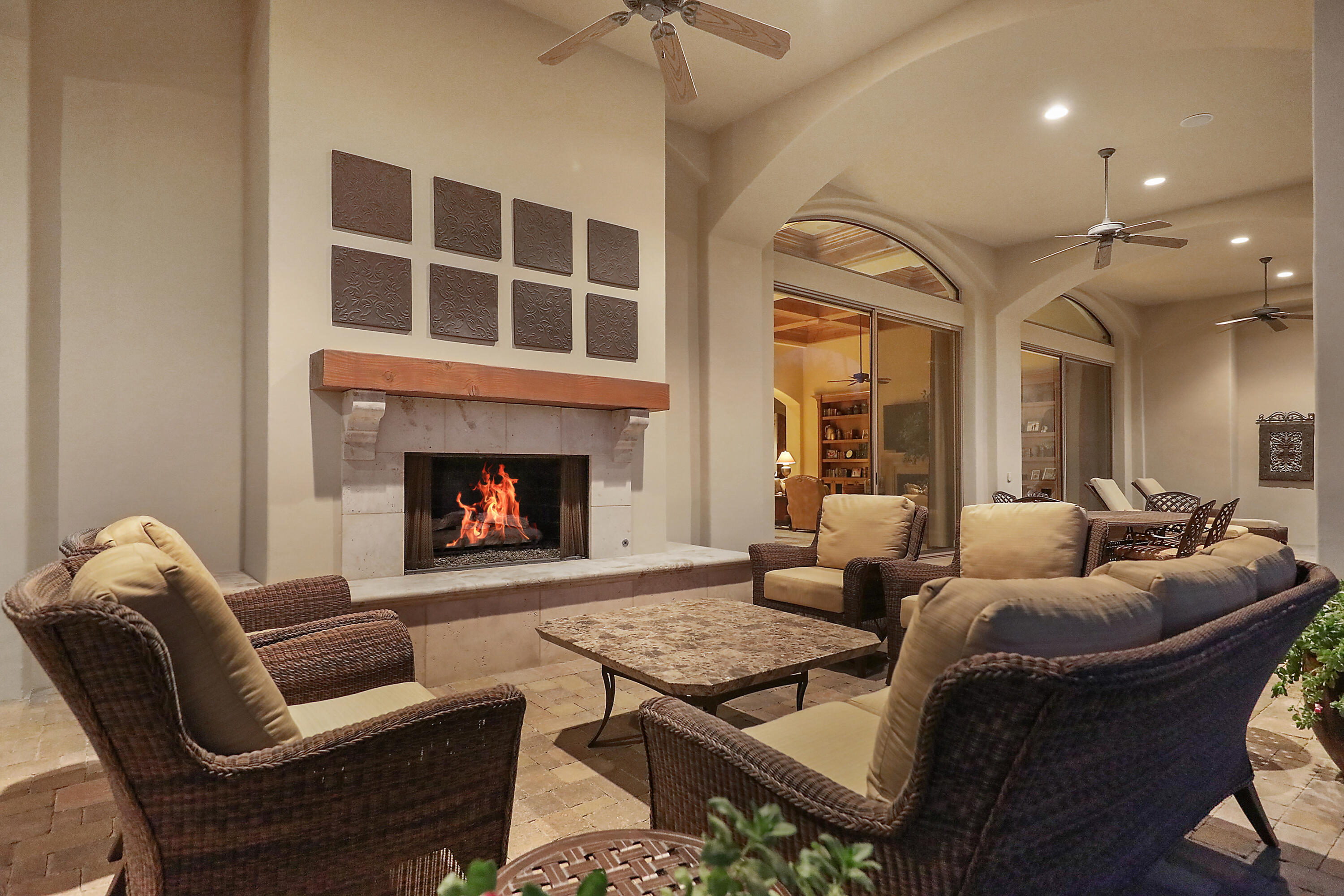 50360 Woodmere La Quinta, CA 92253 - Photo 39 of 56 a living room with furniture a fireplace and a chandelier