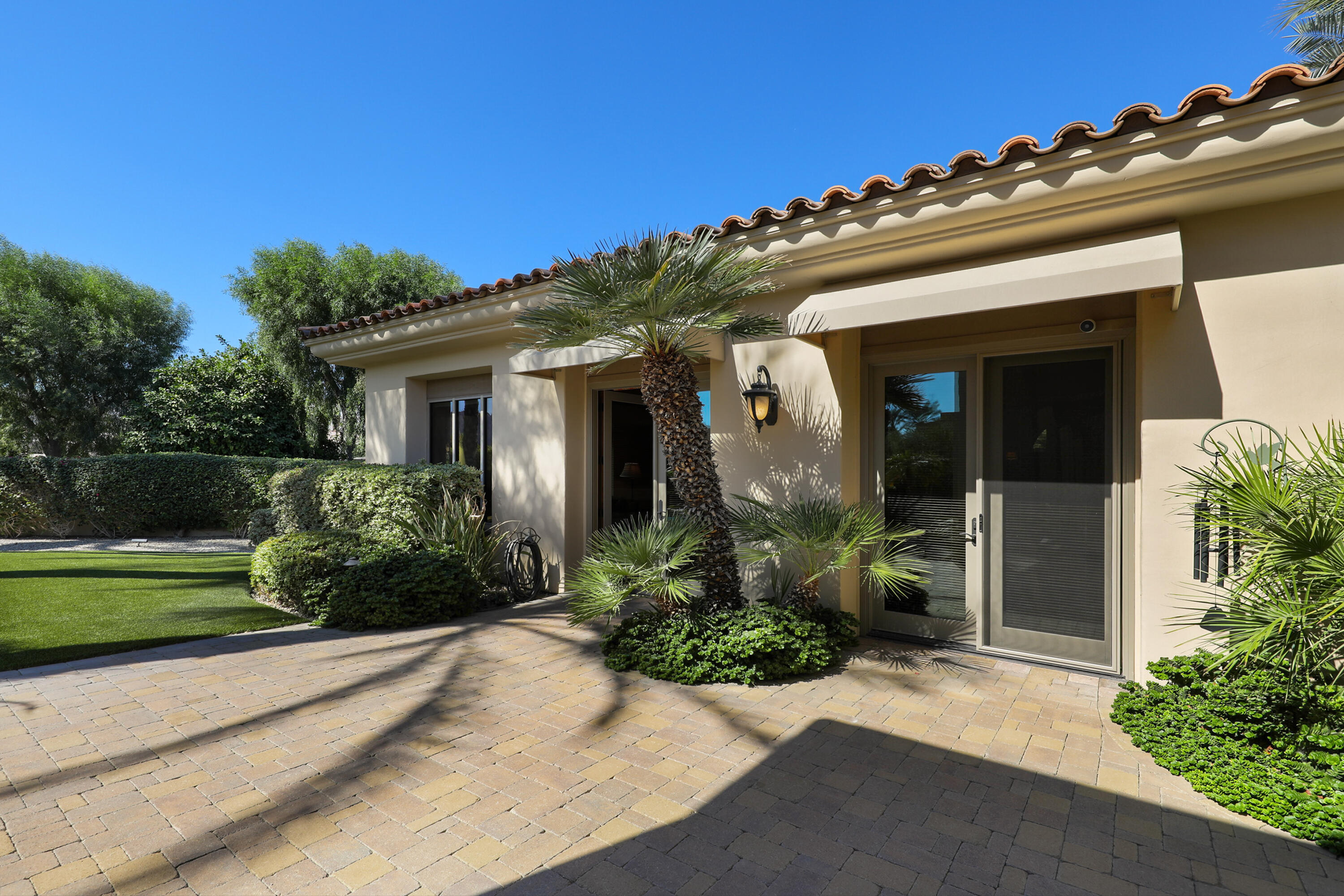 50360 Woodmere La Quinta, CA 92253 - Photo 44 of 56 front view of a house with a yard