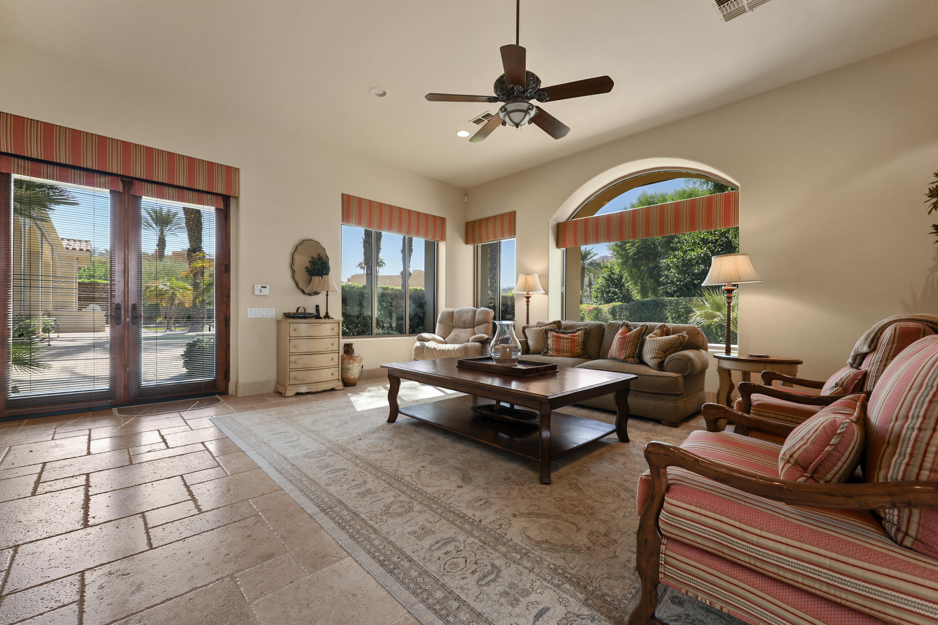 50360 Woodmere La Quinta, CA 92253 - Photo 45 of 56 a living room with furniture and a floor to ceiling window