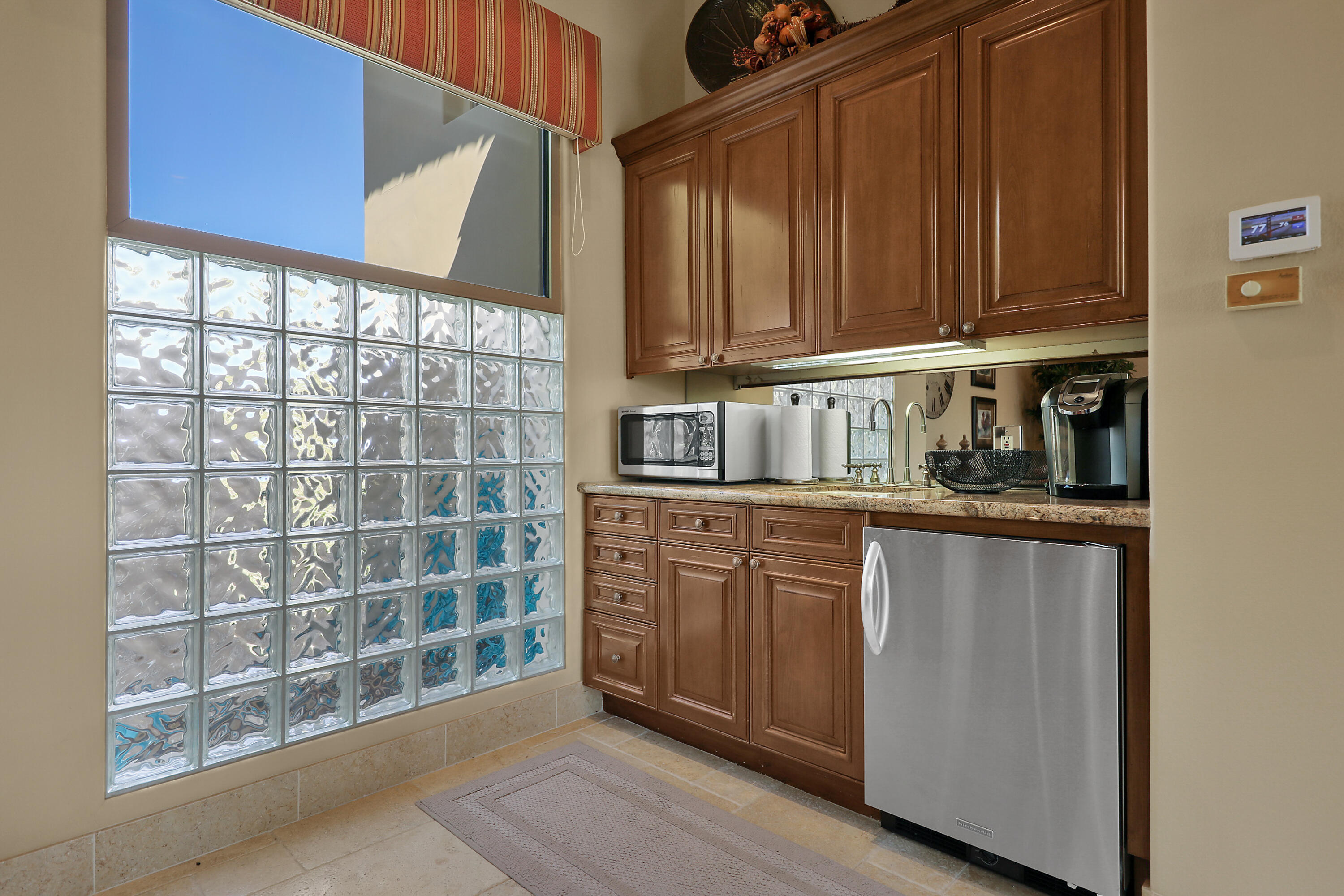 50360 Woodmere La Quinta, CA 92253 - Photo 49 of 56 a kitchen with a sink and cabinets
