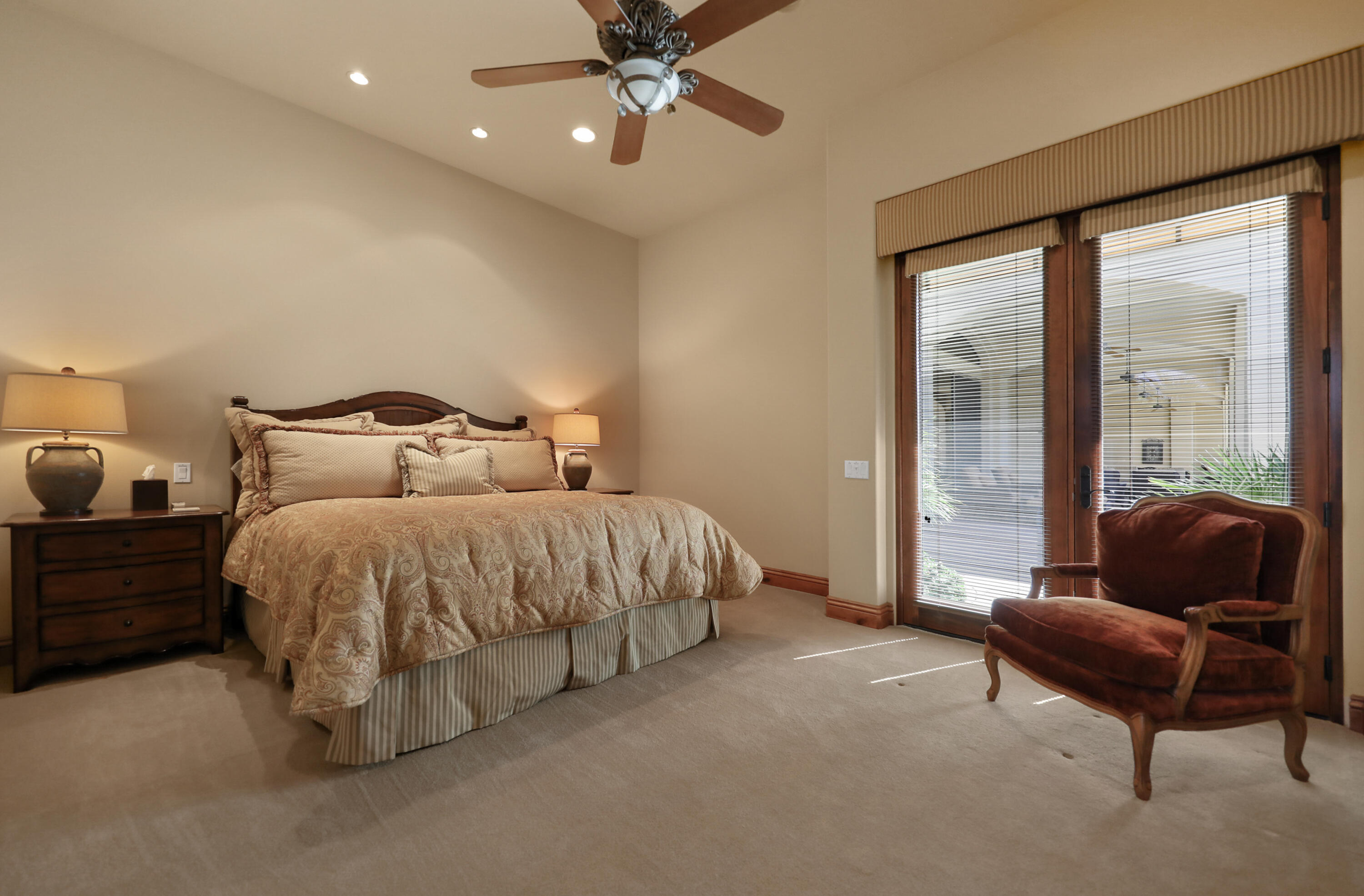 50360 Woodmere La Quinta, CA 92253 - Photo 50 of 56 a spacious bedroom with a bed and glass window