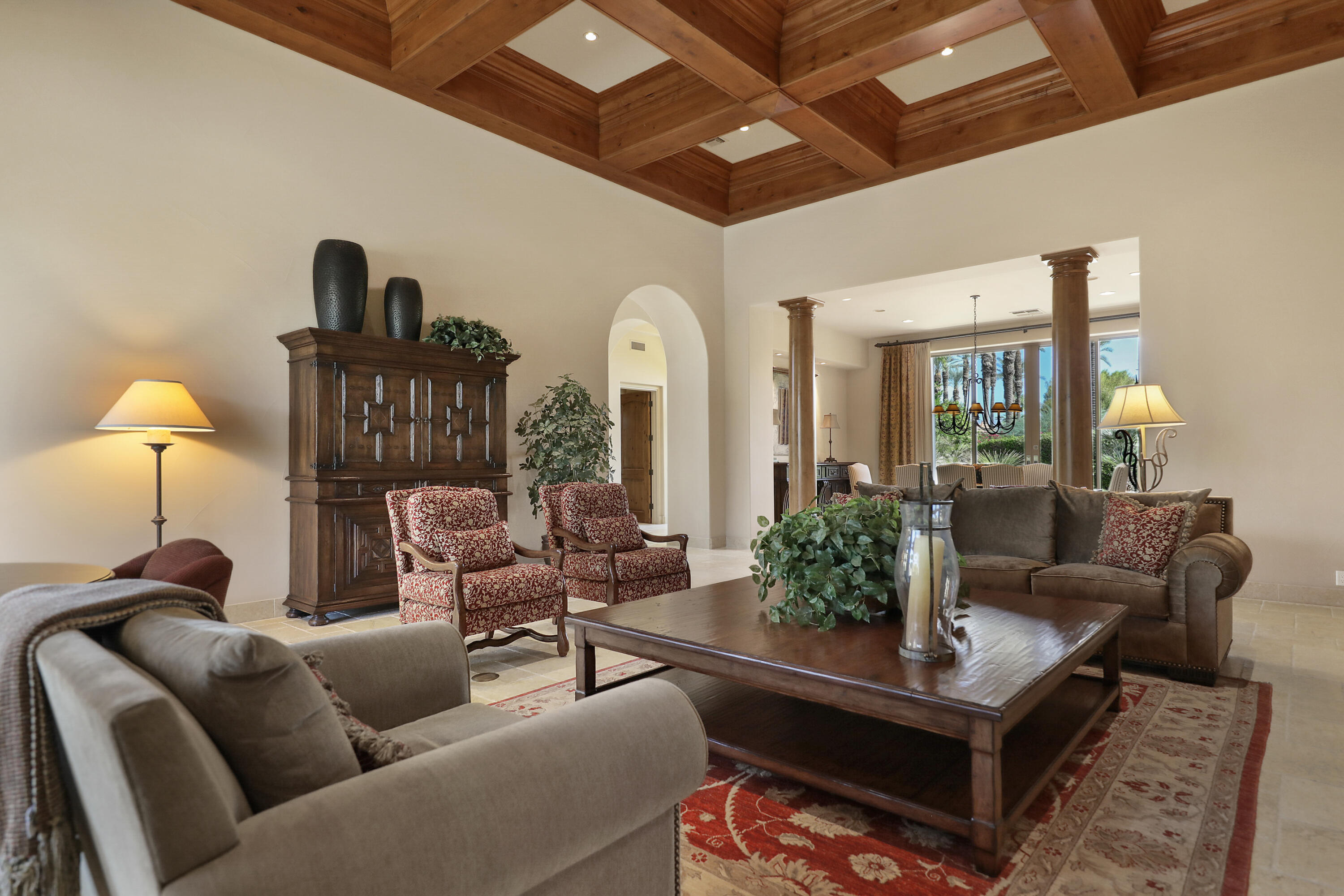 50360 Woodmere La Quinta, CA 92253 - Photo 10 of 56 a living room with furniture a lamp and a rug