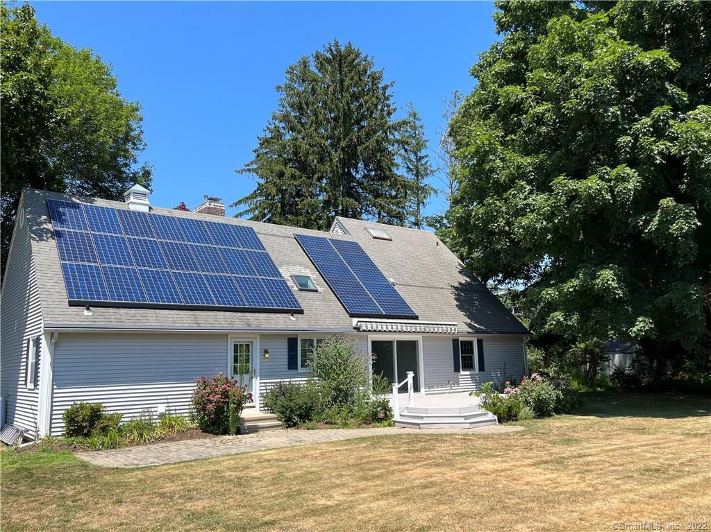 8 Ledge Road Old Saybrook, CT 06475 - Photo 1 of 1 a front view of a house with a yard