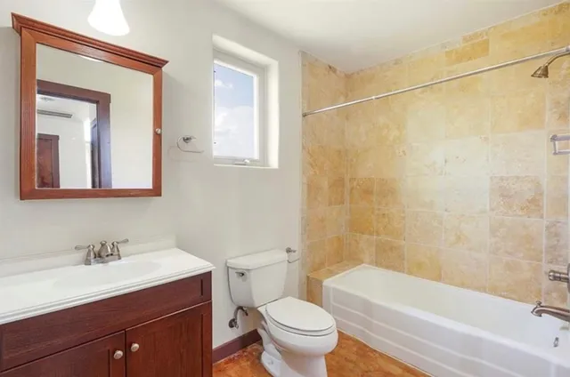 a bathroom with a sink a toilet and a bathtub