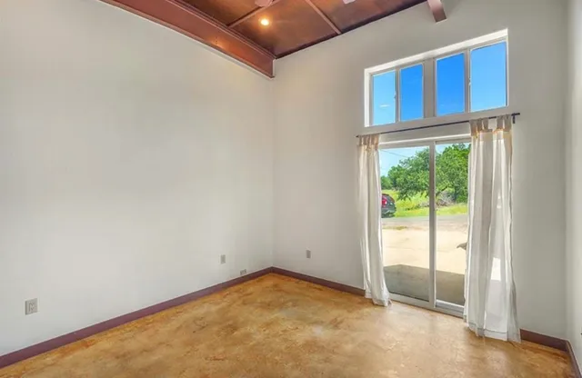 a view of an empty room and window