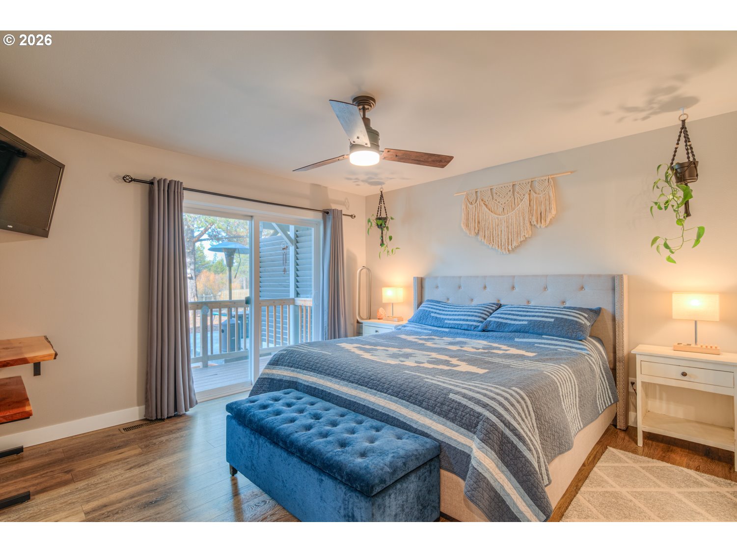 16732 Contorta Place La Pine, OR 97739 - Photo 18 of 48 a bedroom with a bed and a chandelier