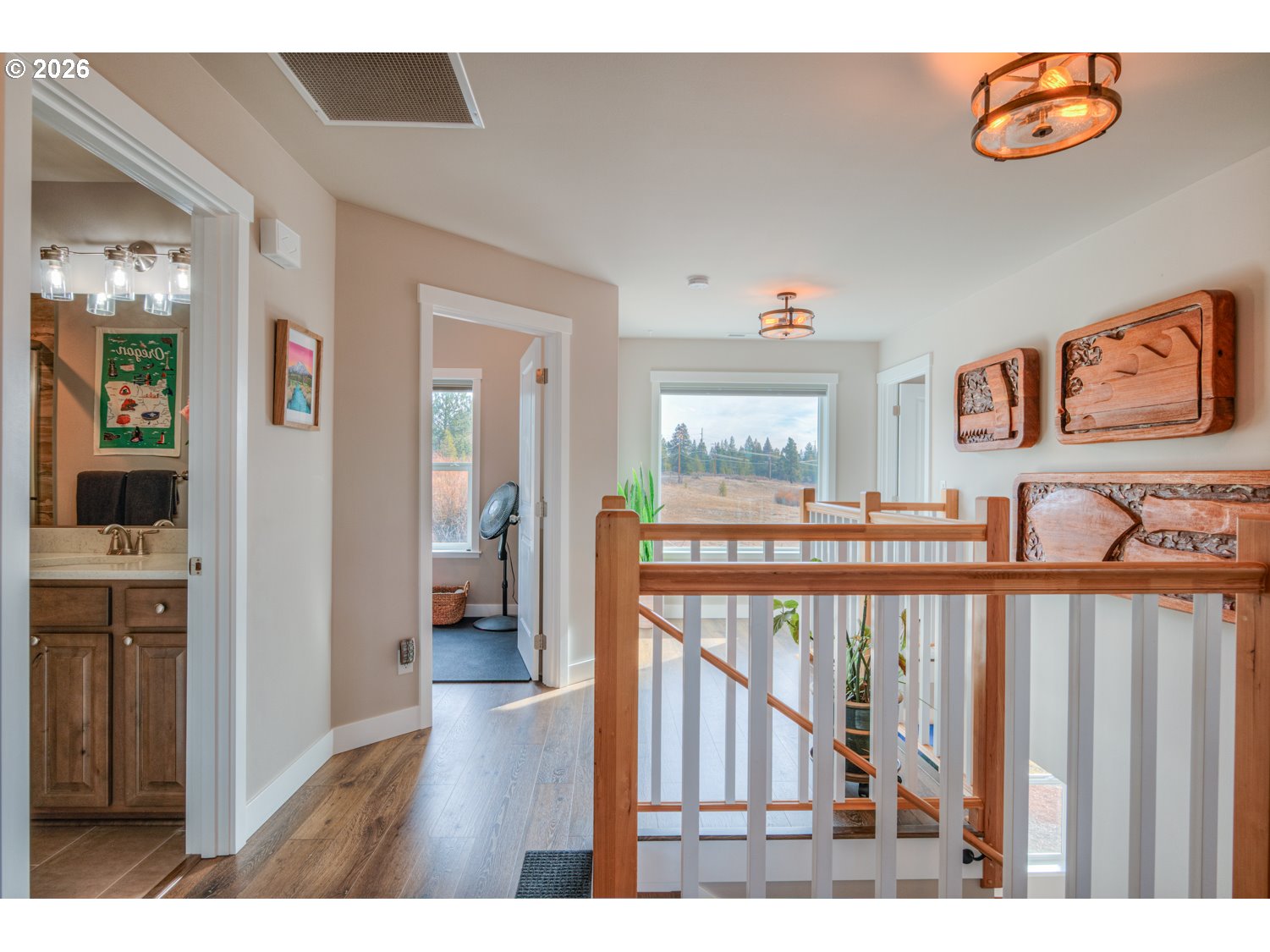 16732 Contorta Place La Pine, OR 97739 - Photo 22 of 48 a view of a hallway with wooden floor and dining room view