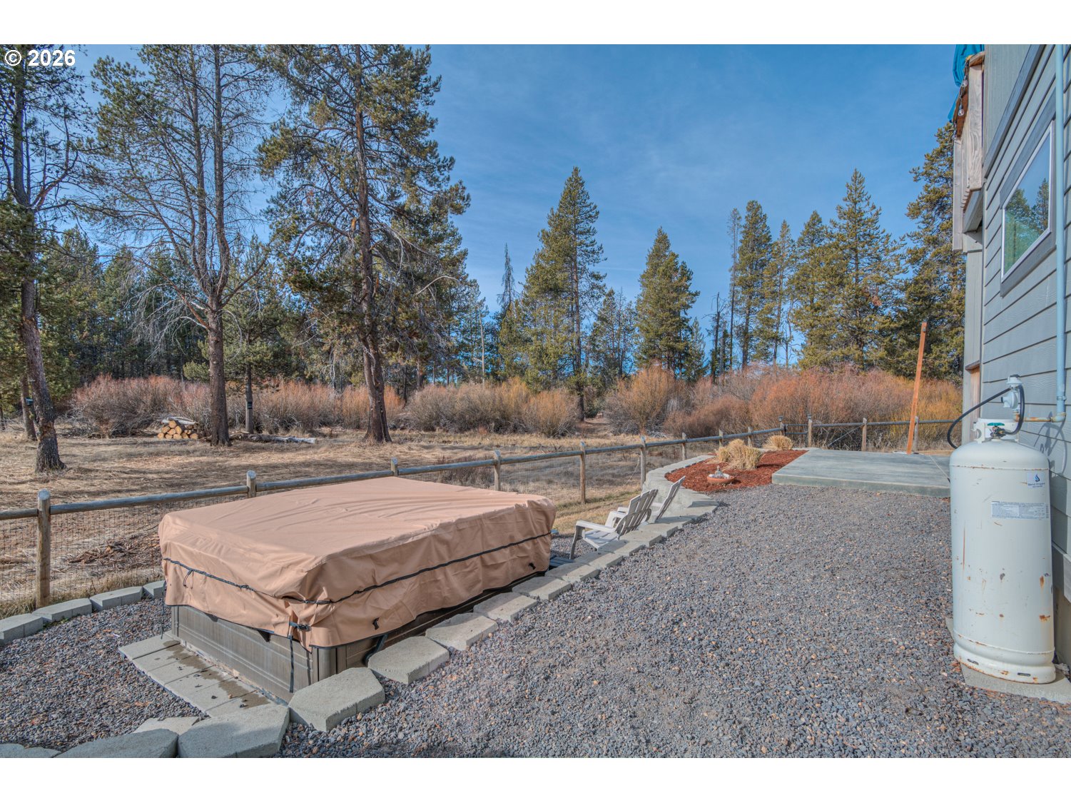 16732 Contorta Place La Pine, OR 97739 - Photo 6 of 48 a backyard of a house with table and chairs