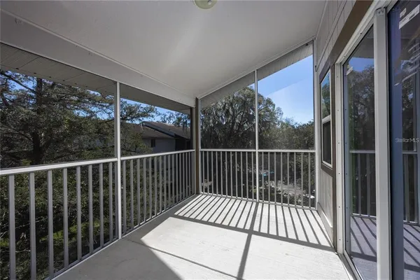 a view of balcony with wooden floor