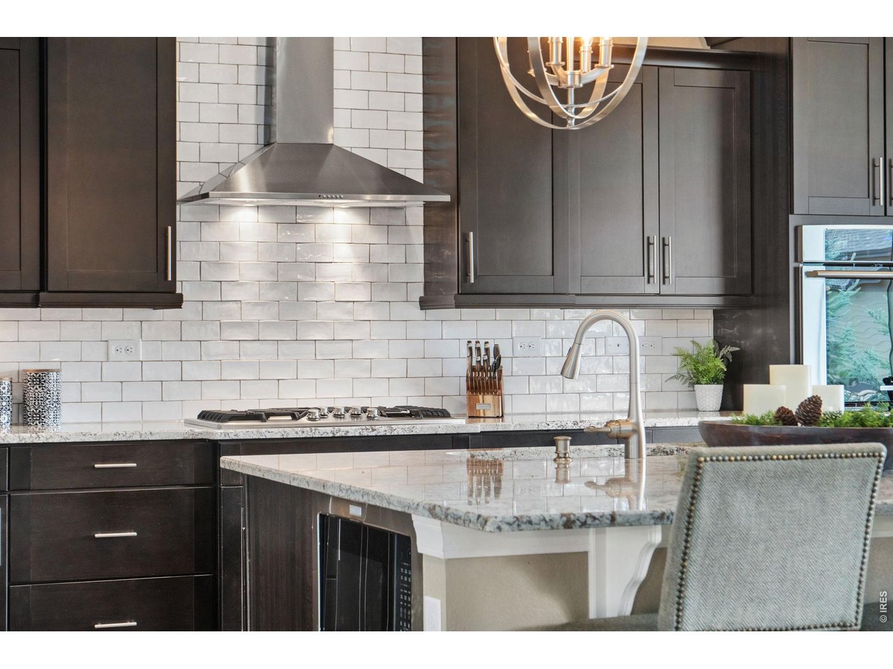 5879 Story Road Timnath, CO 80547 - Photo 12 of 49 Stylish backsplash compliments the modern yet warm feeling in this home