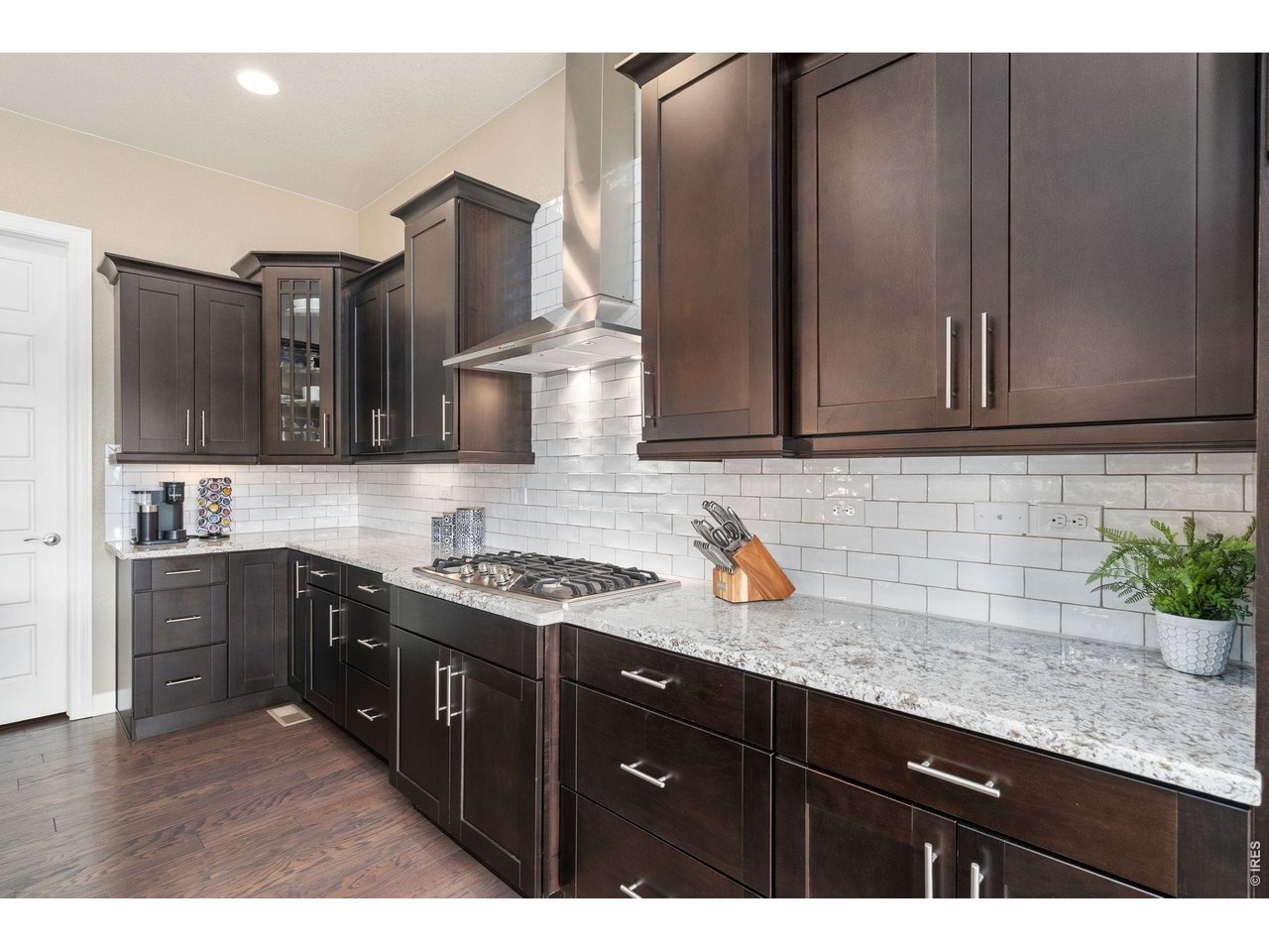 5879 Story Road Timnath, CO 80547 - Photo 14 of 49 Abundant cabinetry and counter space as well as a walk-in pantry
