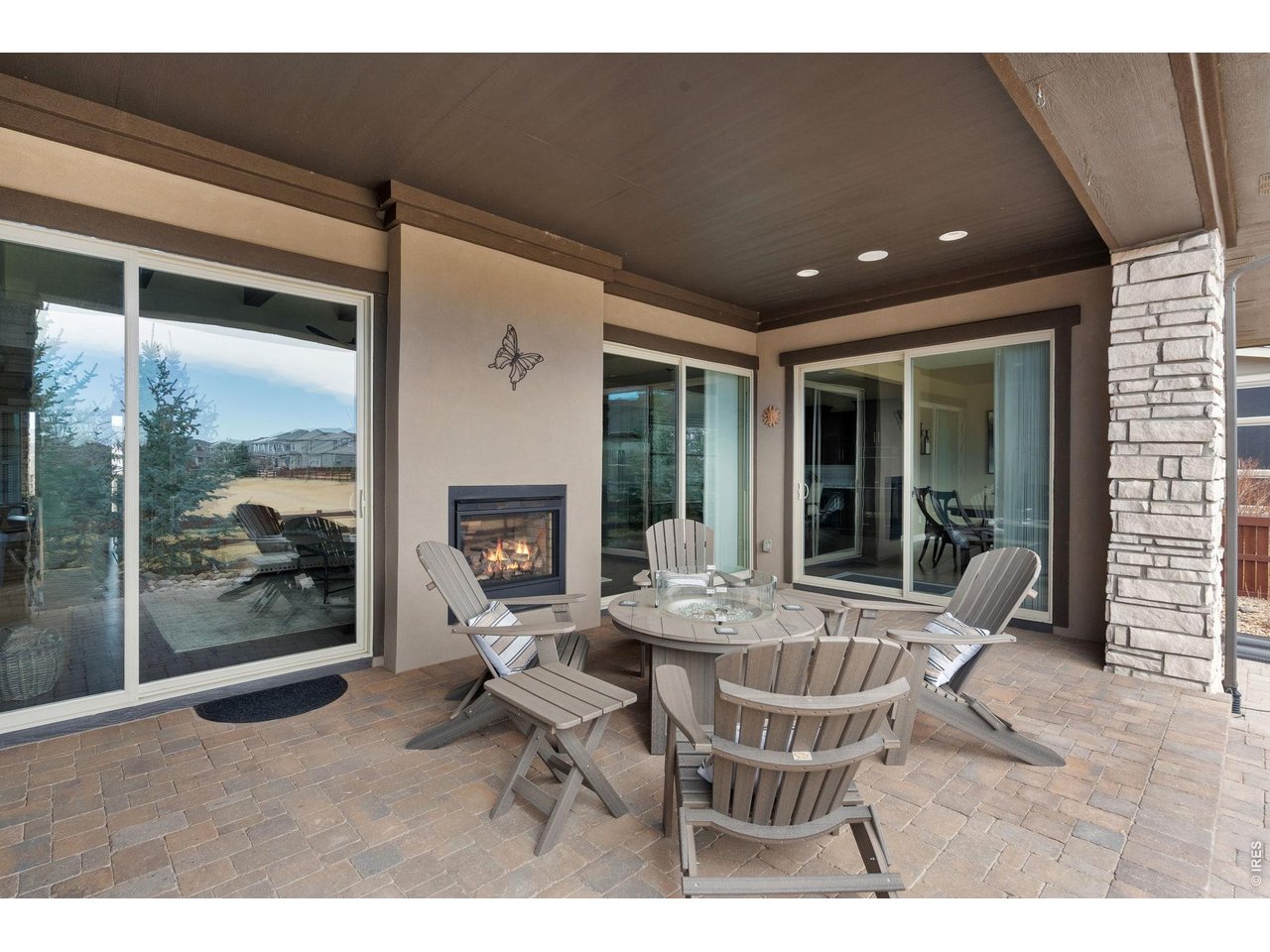 5879 Story Road Timnath, CO 80547 - Photo 17 of 49 Covered back patio is the perfect place to relax and have privacy with large trees in the backyard