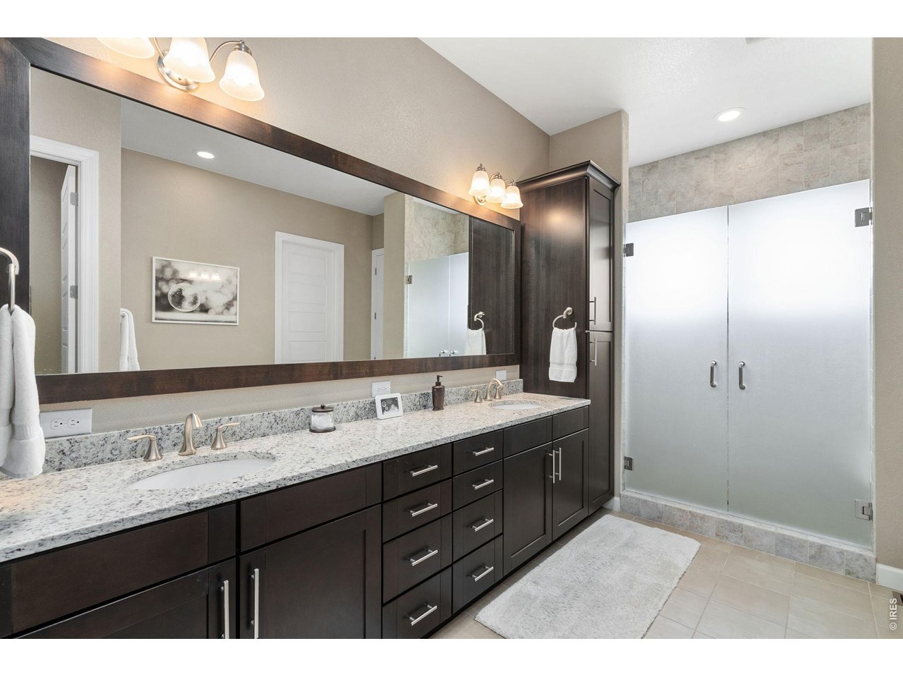 5879 Story Road Timnath, CO 80547 - Photo 20 of 49 Five piece luxury bath with double vanities and large shower; entrance to the bath is via a custom barn door