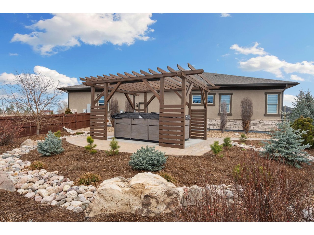 5879 Story Road Timnath, CO 80547 - Photo 44 of 49 Easy care stone and stucco exterior with custom landscaping