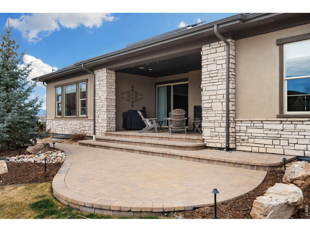 5879 Story Road Timnath, CO 80547 - Photo 46 of 49 Gas line is stubbed right off the patio. Walkways and trees are illuminated and controlled by a time