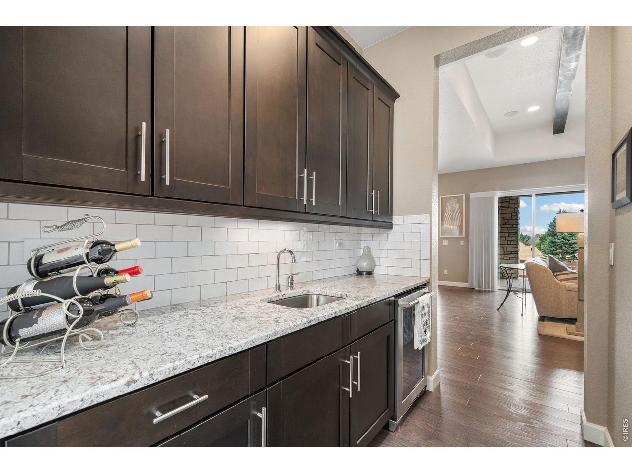 5879 Story Road Timnath, CO 80547 - Photo 6 of 49 Butler's pantry for more storage and convenient beverage refrigerator for easy service to the formal dining room