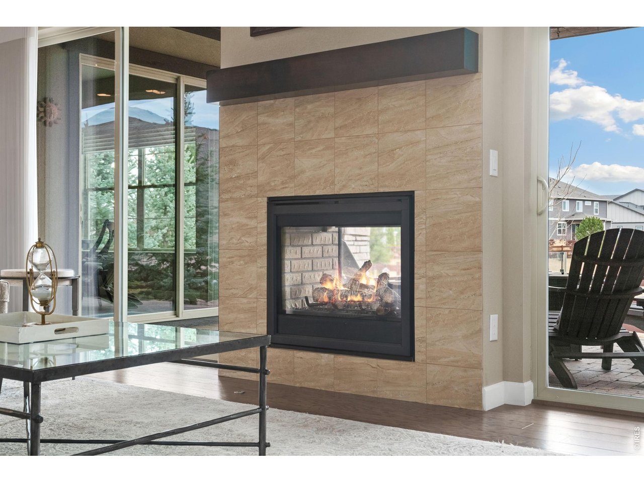 5879 Story Road Timnath, CO 80547 - Photo 10 of 49 See through fireplace to back paver patio