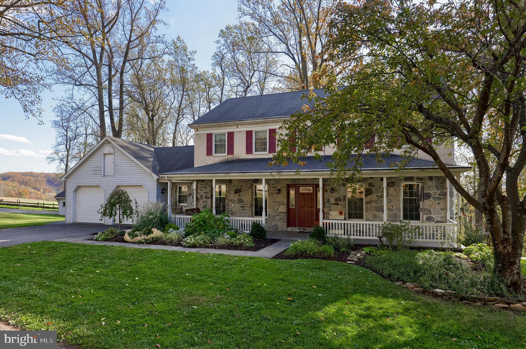 339 Churchtown Road Narvon, PA 17555 - Photo 34 of 98 a front view of a house with a garden and trees
