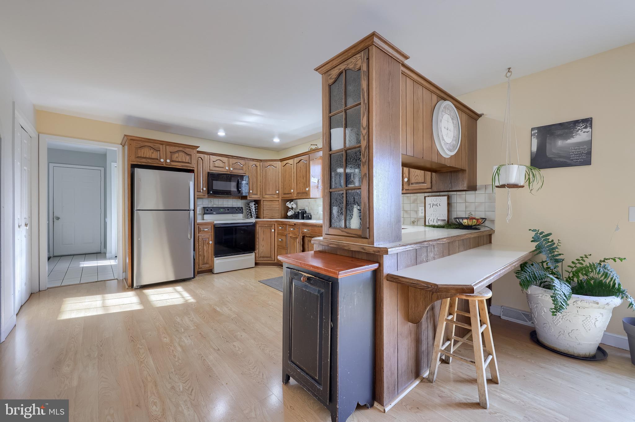 339 Churchtown Road Narvon, PA 17555 - Photo 74 of 98 a kitchen with stainless steel appliances granite countertop a sink and a refrigerator