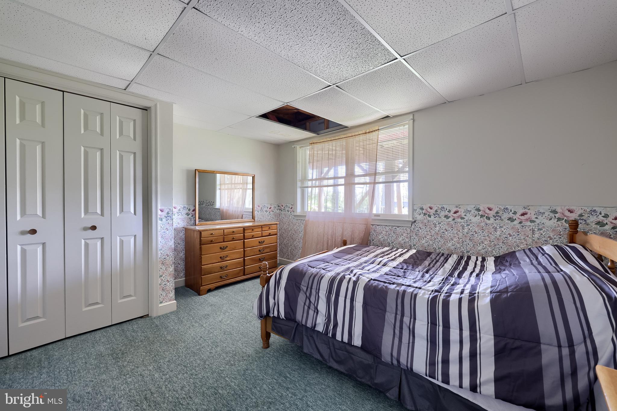 339 Churchtown Road Narvon, PA 17555 - Photo 88 of 98 a bedroom with a bed and dresser with window