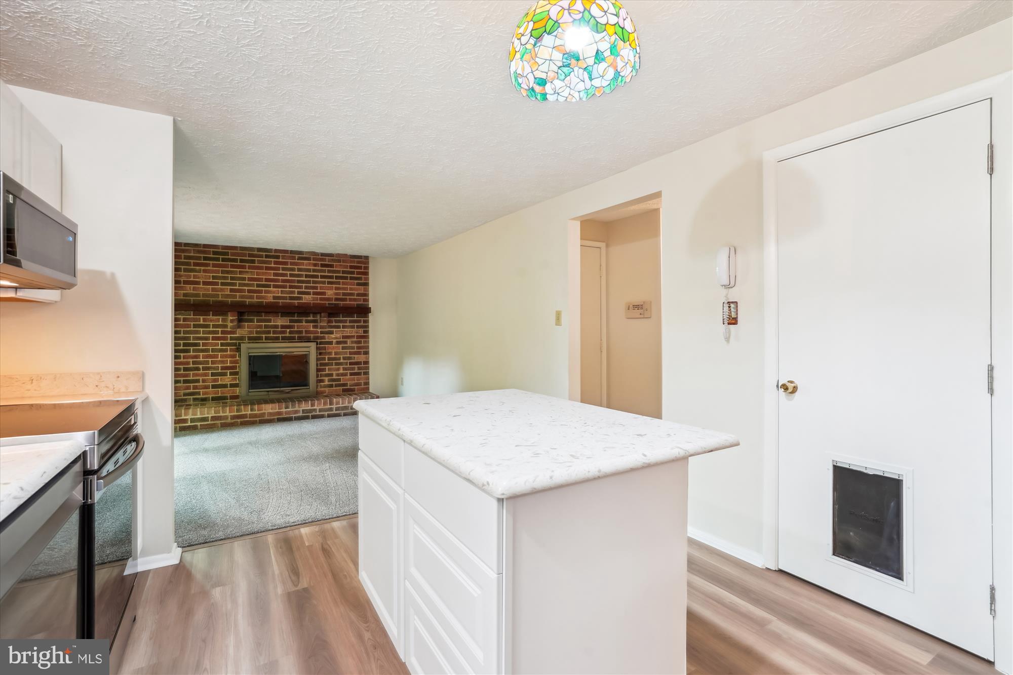 1221 Windmill Lane Silver Spring, MD 20905 - Photo 11 of 38 a view of kitchen with granite countertop cabinets and wooden floor