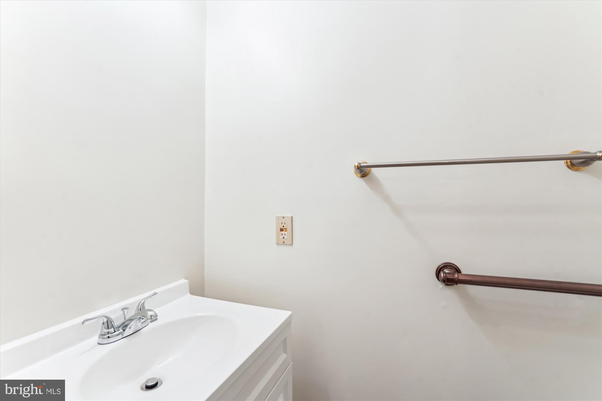 1221 Windmill Lane Silver Spring, MD 20905 - Photo 15 of 38 a bathroom with a sink and a mirror