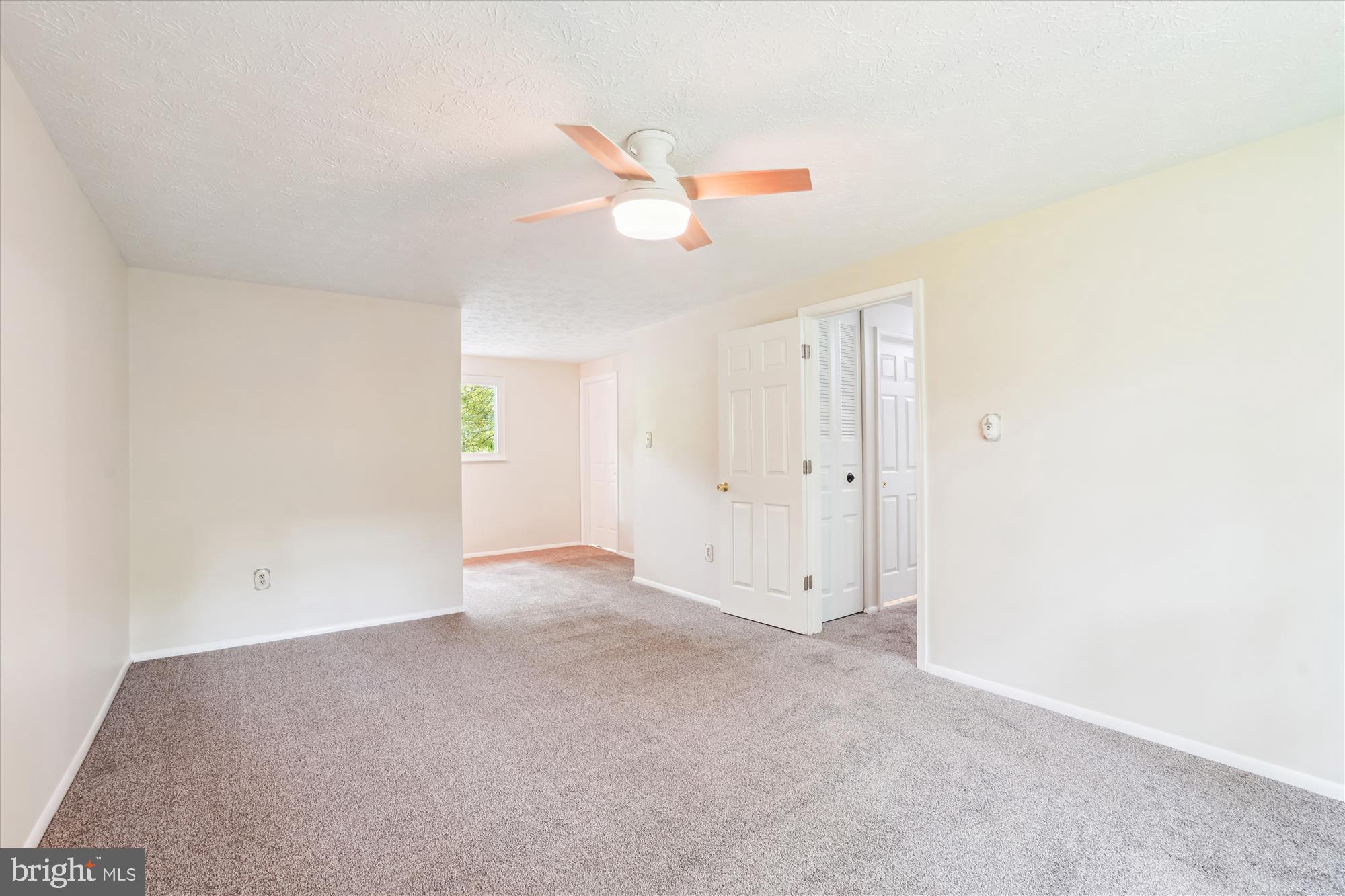 1221 Windmill Lane Silver Spring, MD 20905 - Photo 17 of 38 an empty room with closet and windows