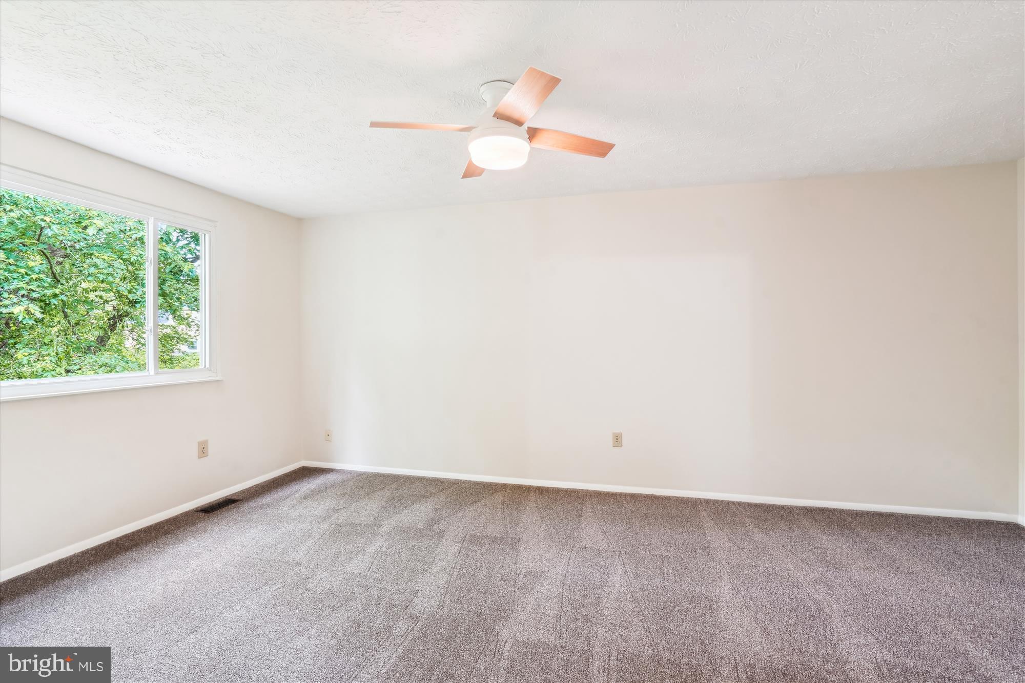 1221 Windmill Lane Silver Spring, MD 20905 - Photo 18 of 38 an empty room with a window