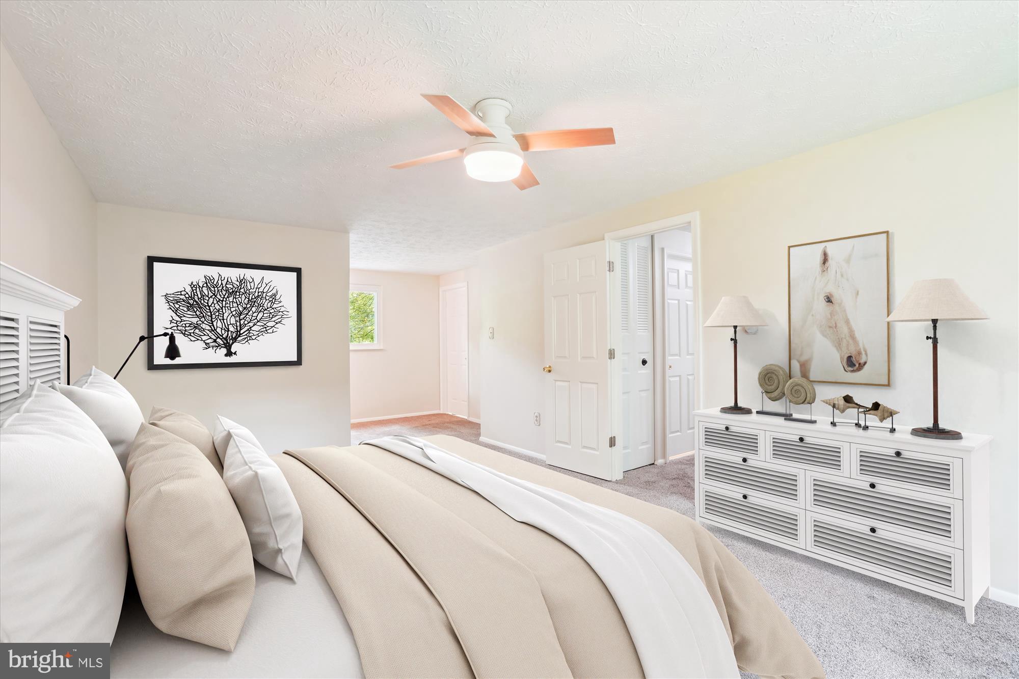 1221 Windmill Lane Silver Spring, MD 20905 - Photo 4 of 38 a bedroom with a bed and a chandelier