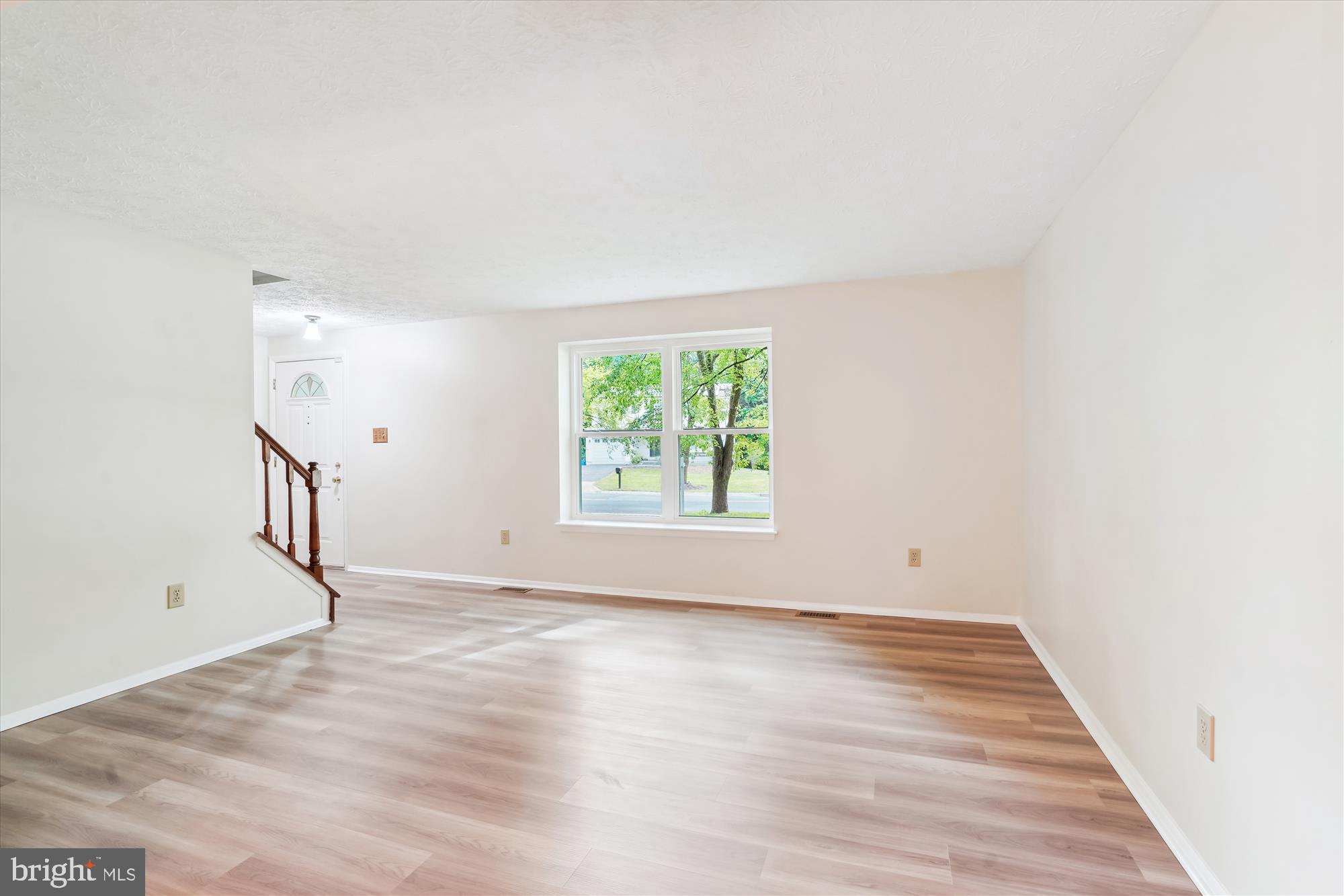1221 Windmill Lane Silver Spring, MD 20905 - Photo 5 of 38 a view of empty room with wooden floor and fan