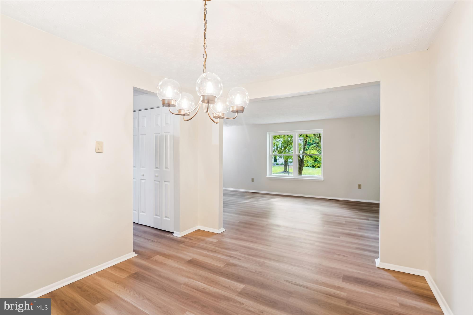 1221 Windmill Lane Silver Spring, MD 20905 - Photo 9 of 38 a view of a room with wooden floor mirror and window