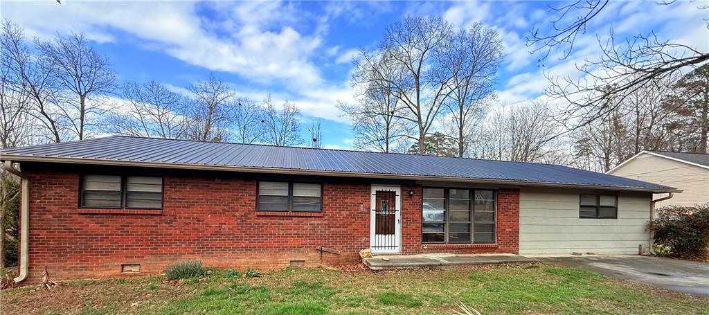 308 Thor Avenue Calhoun, GA 30701 - Photo 2 of 2 a front view of a house with garden