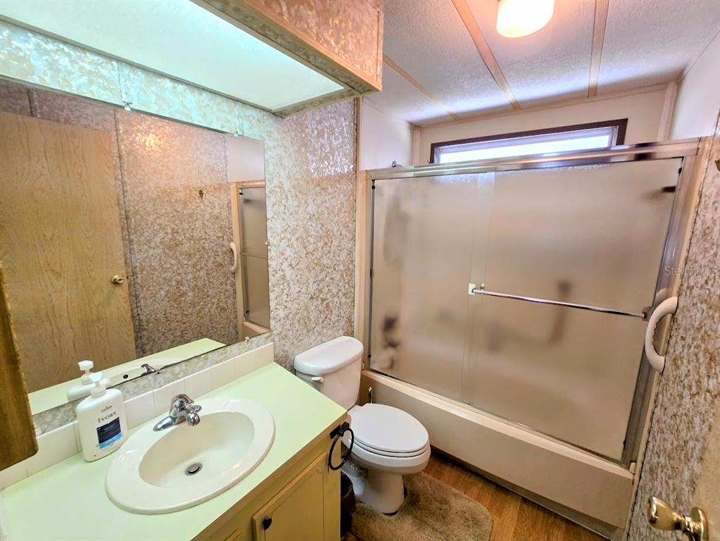 12501 Ulmerton Road, Unit 188 Largo, FL 33774 - Photo 26 of 63 a bathroom with a sink toilet and shower