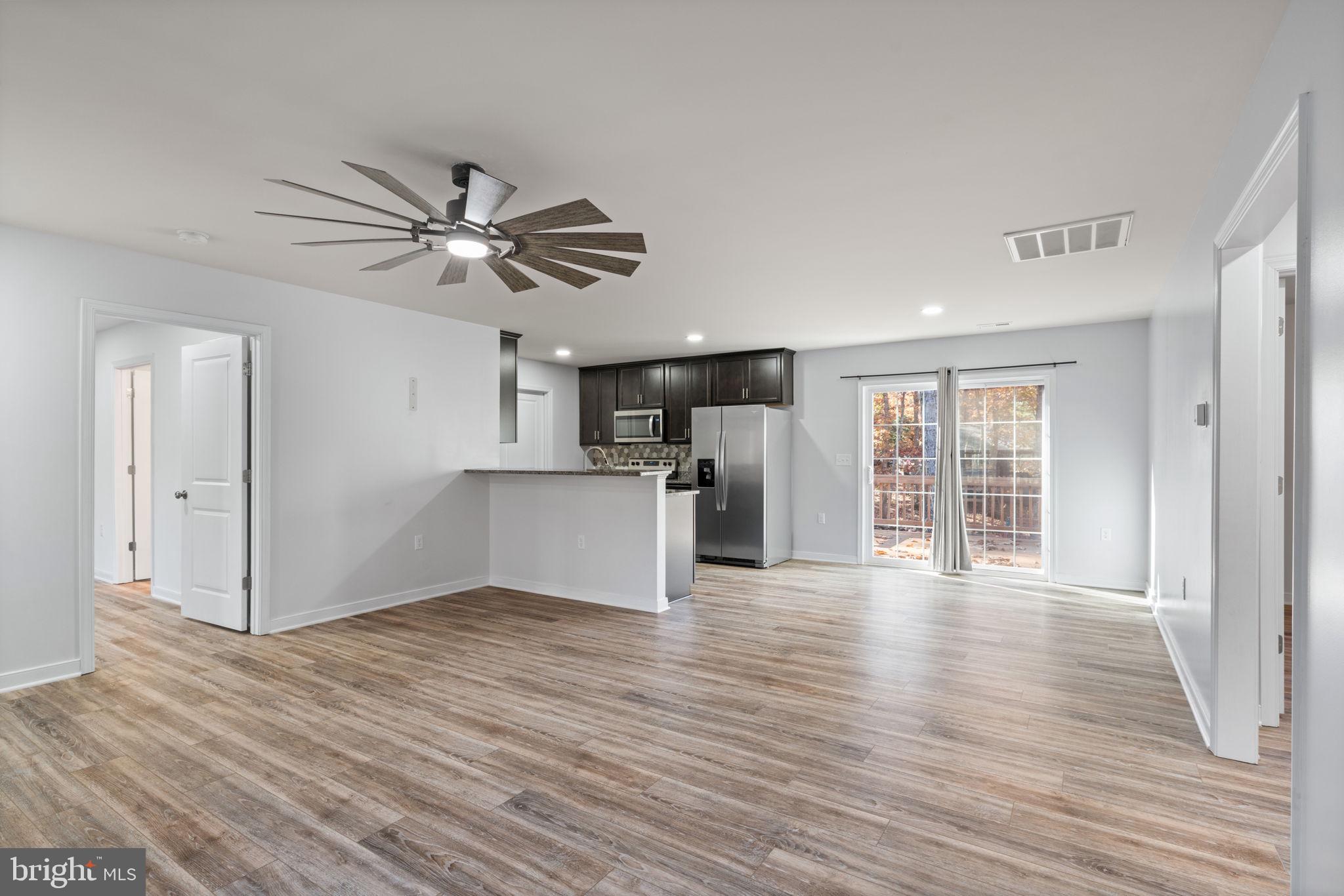 55 Cedar Circle Mineral, VA 23117 - Photo 14 of 44 a view of an empty room with window and wooden floor
