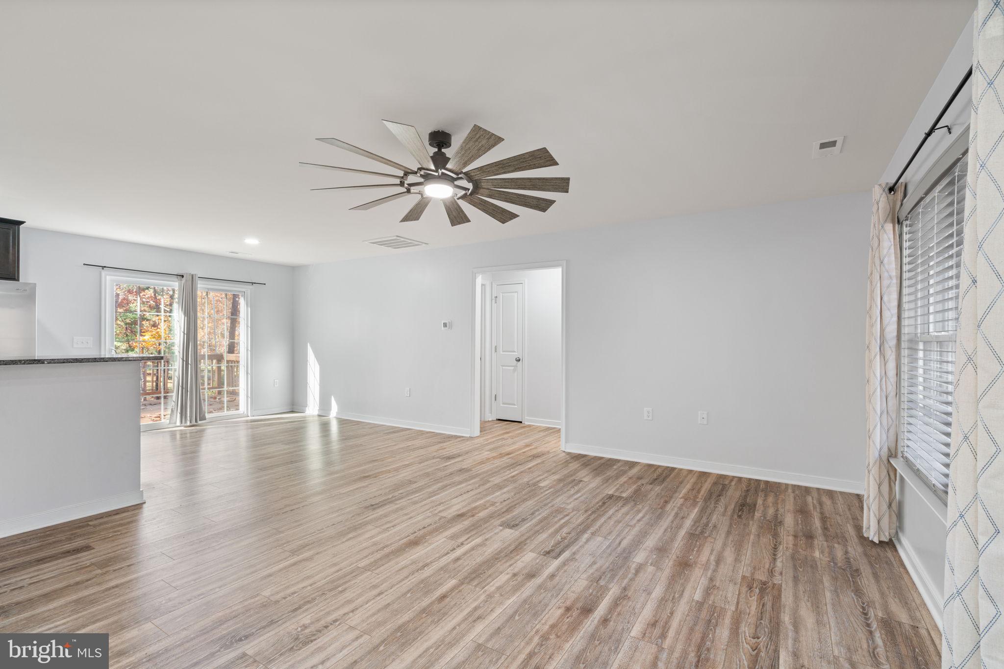 55 Cedar Circle Mineral, VA 23117 - Photo 18 of 44 a view of an empty room with wooden floor and a window