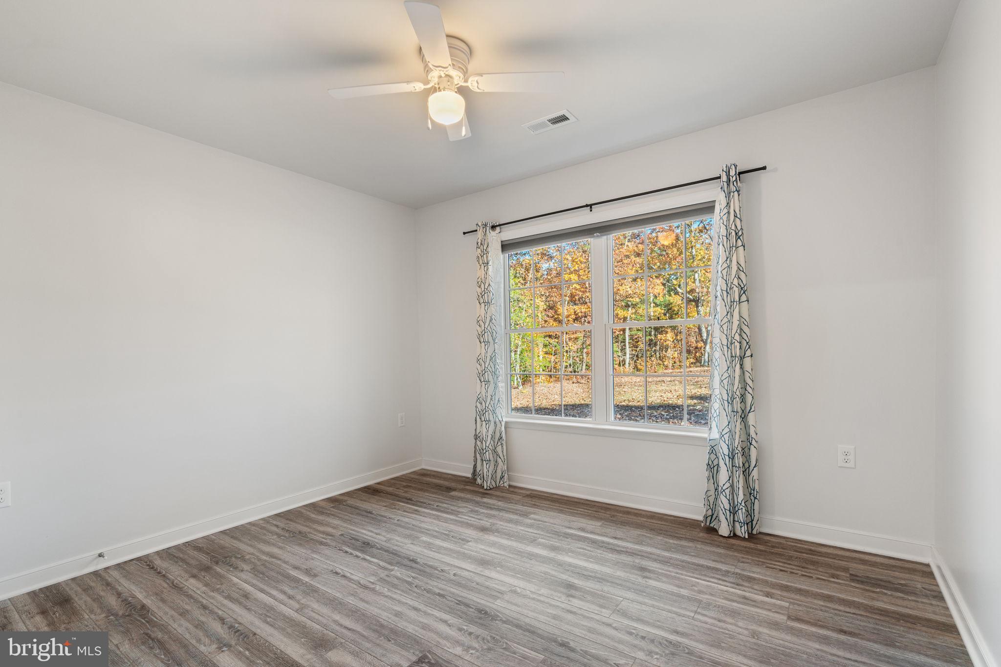 55 Cedar Circle Mineral, VA 23117 - Photo 31 of 44 wooden floor in an empty room with a window