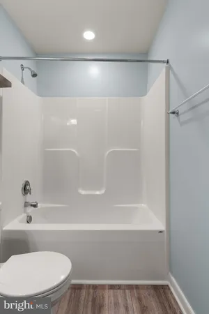 a bathroom with a sink a toilet a mirror and vanity