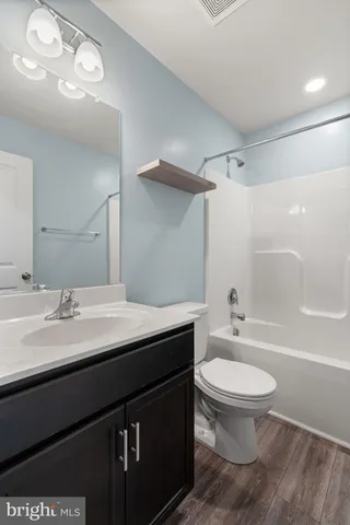 a bathroom with a bathtub and a sink