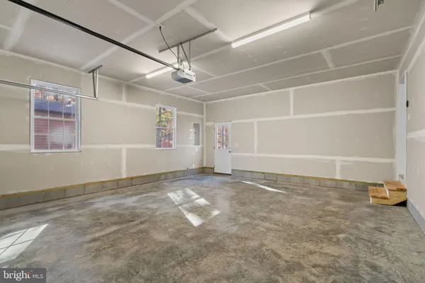 a view of balcony with wooden floor and fence