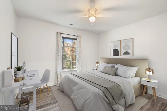 a bedroom with a large bed and a window