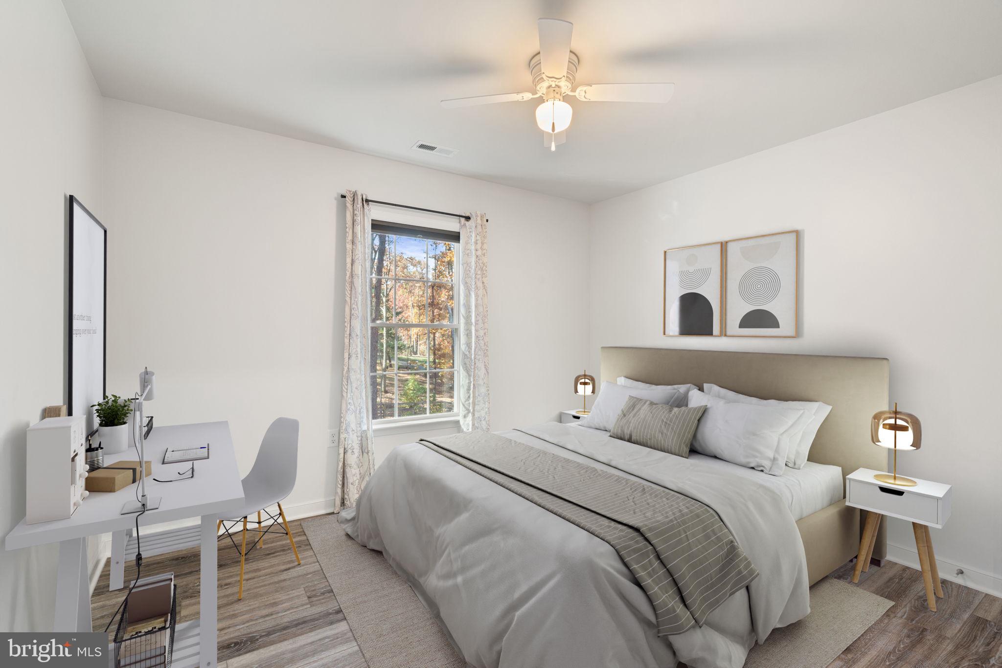 55 Cedar Circle Mineral, VA 23117 - Photo 6 of 44 a bedroom with a bed and wooden floor