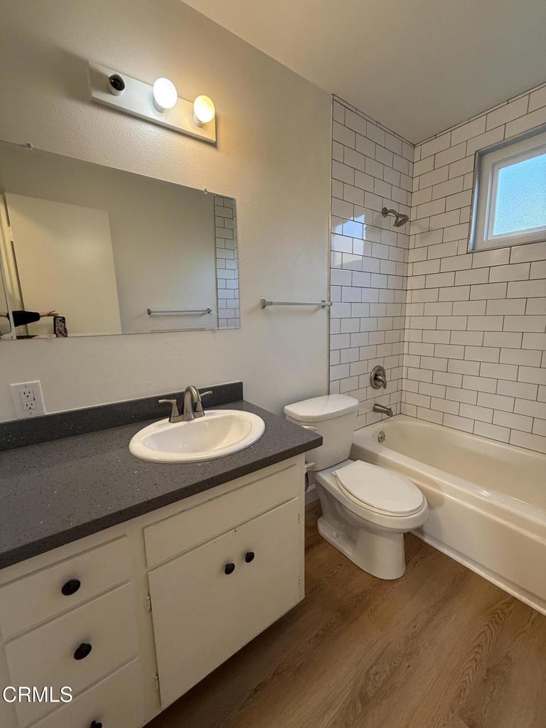 1171 Meta Street, Unit 16 Ventura, CA 93001 - Photo 11 of 15 a bathroom with a double vanity sink toilet and bathtub