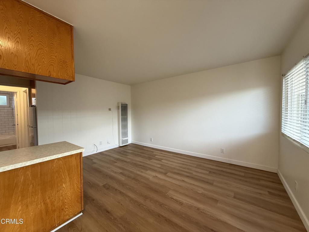 1171 Meta Street, Unit 16 Ventura, CA 93001 - Photo 4 of 15 a view of empty room with wooden floor