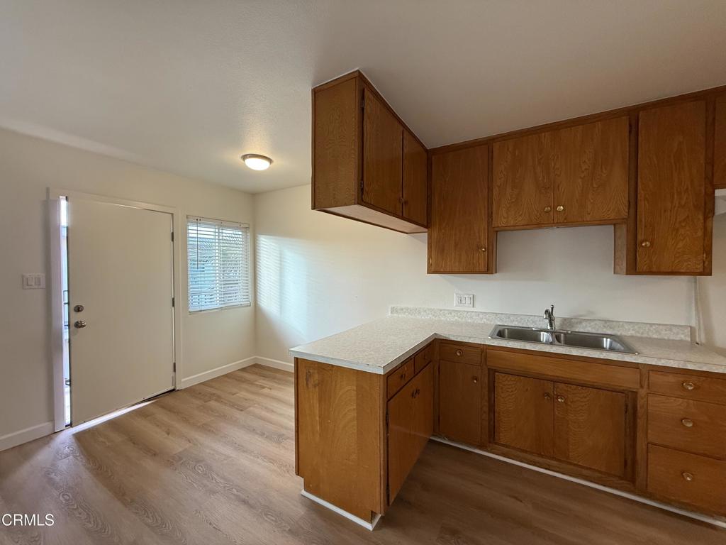 1171 Meta Street, Unit 16 Ventura, CA 93001 - Photo 7 of 15 a kitchen with a sink cabinets and a window