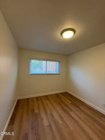 an empty room with a empty space and window