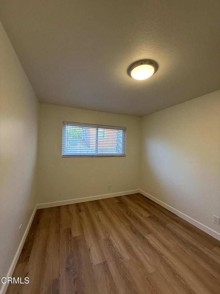 1171 Meta Street, Unit 16 Ventura, CA 93001 - Photo 8 of 15 an empty room with a empty space and window