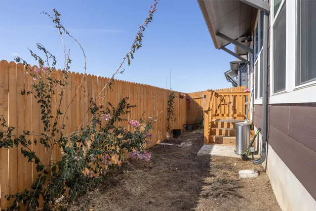 a view of house with a yard