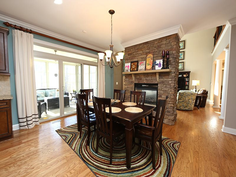 12913 Baybriar Drive Raleigh, NC 27613 - Photo 11 of 25 The kitchen flows into the open and large breakfast area. You can enjoy the fire while cooking and dining. The doors open to the screened porch with Easy Breeze windows. Your living space continues out there. Breakfast Room