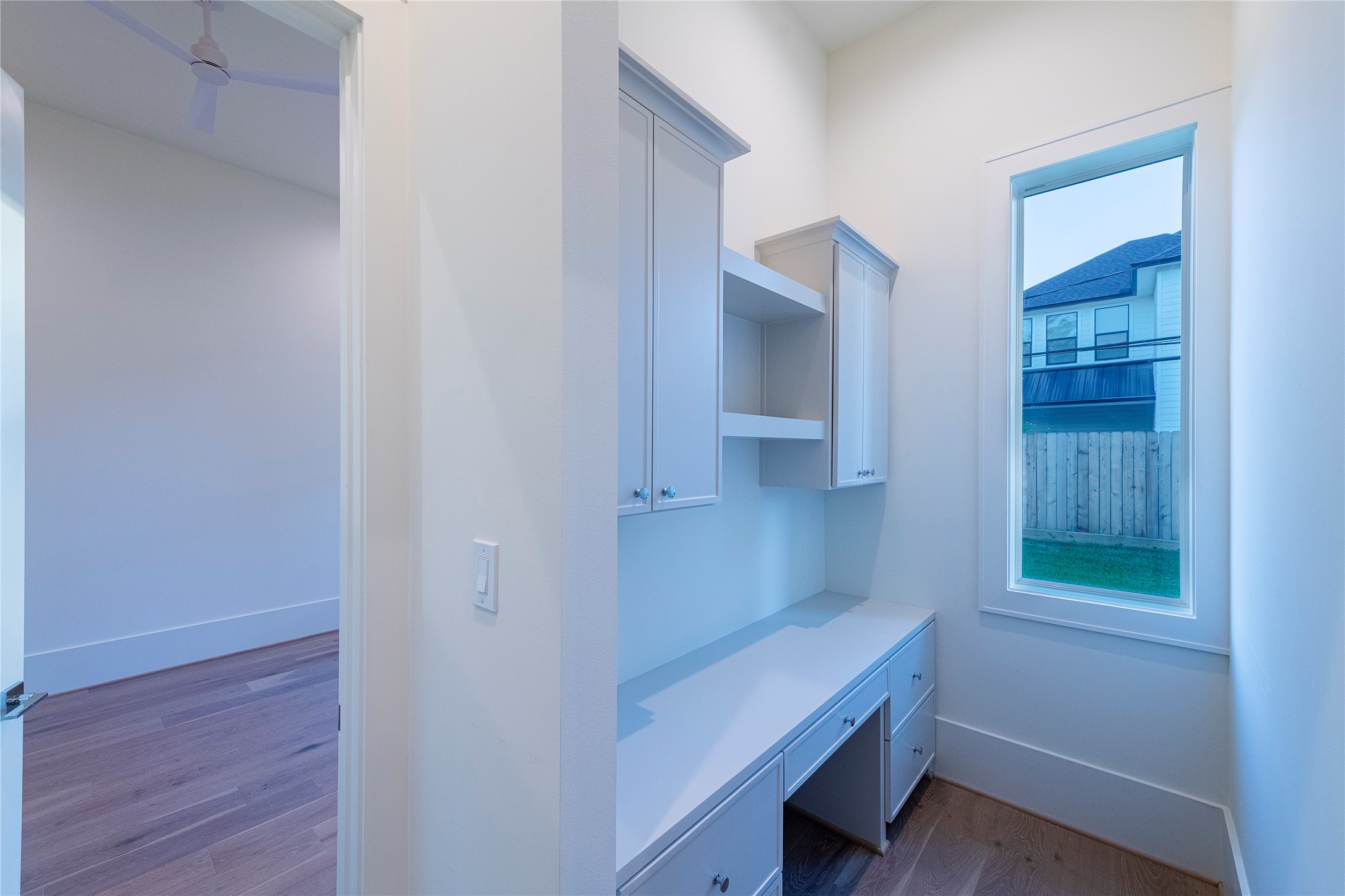 1407 Martin Street Houston, TX 77018 - Photo 15 of 34 a room that has a window and wooden floor